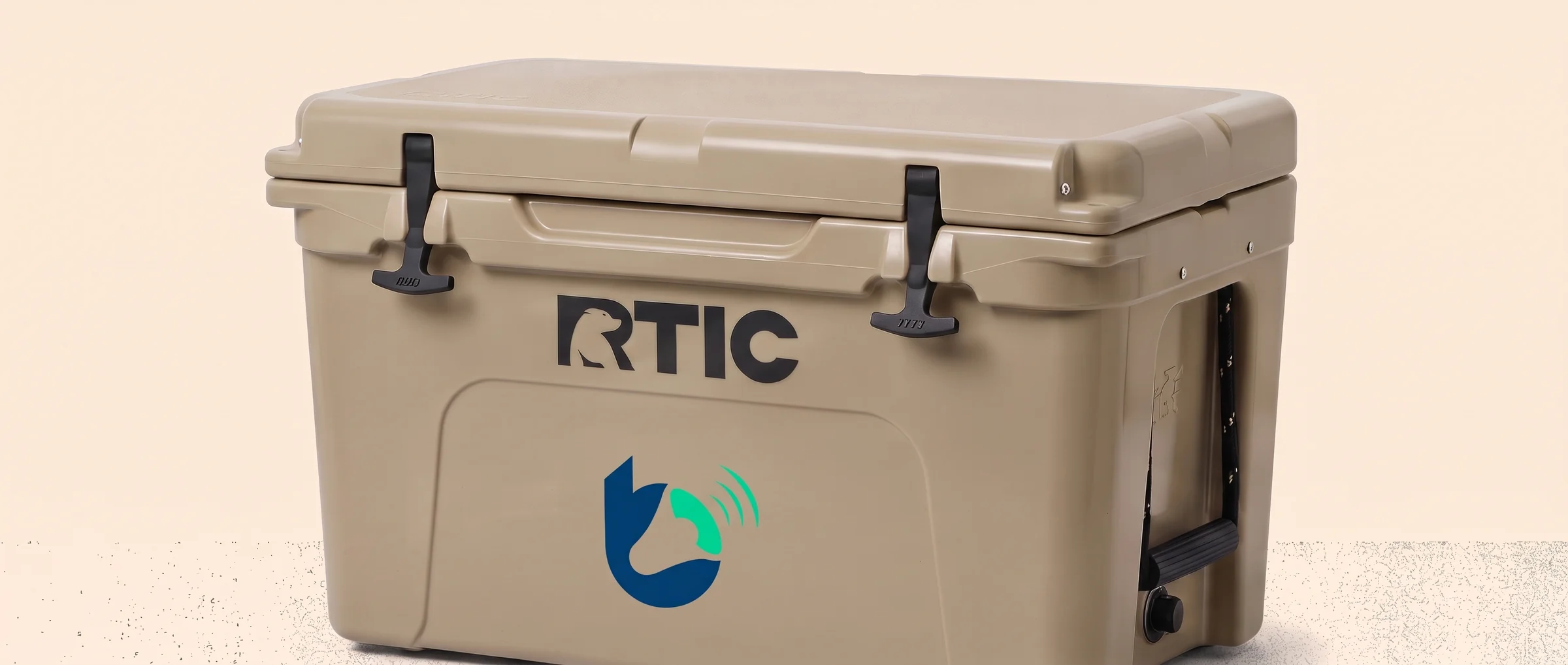 Tan RTIC hard cooler printed with the Brand Builder mark