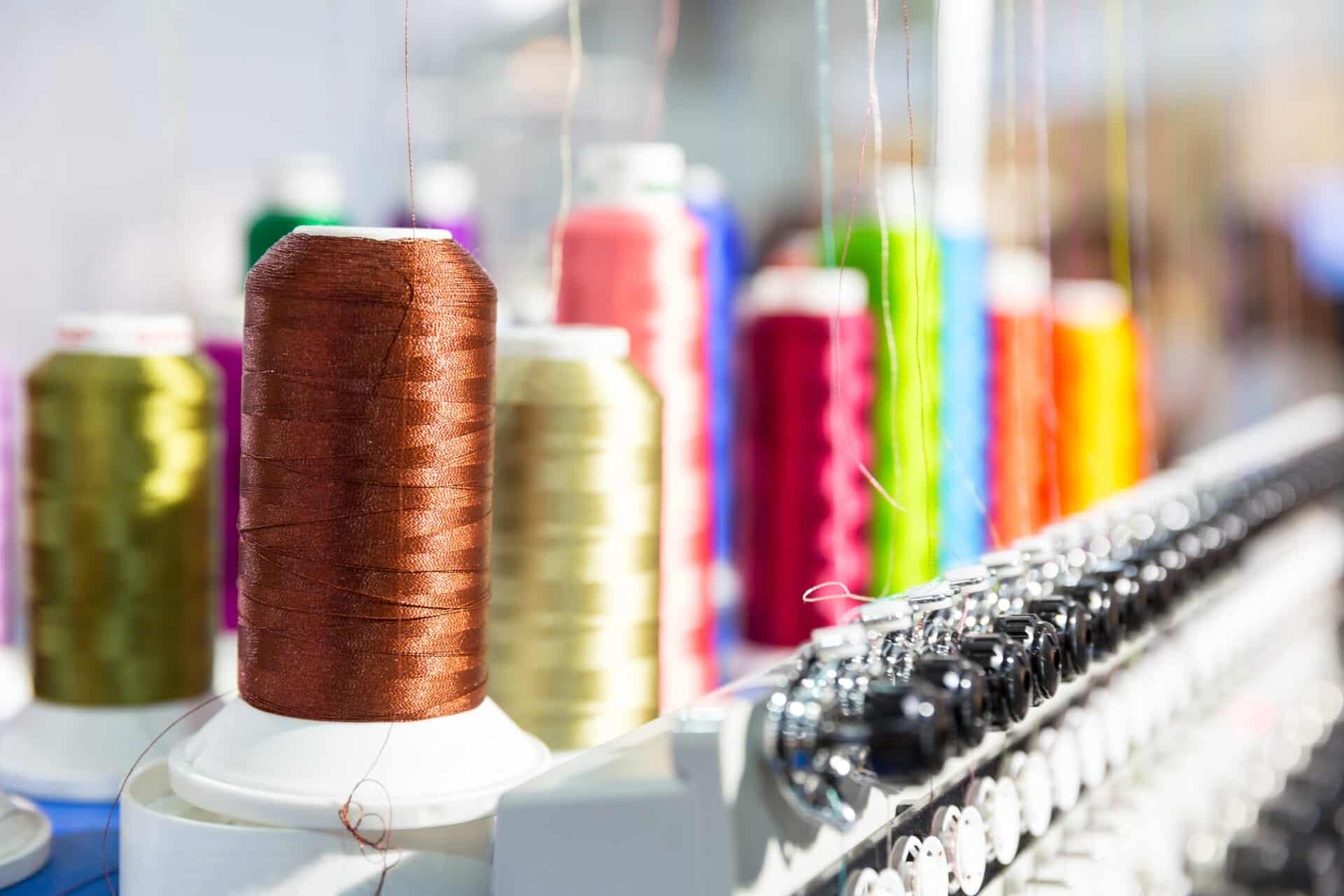 Spools of new threads closeup, sewing machine